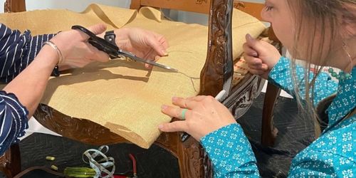 participant and host upholstering at a workshop
